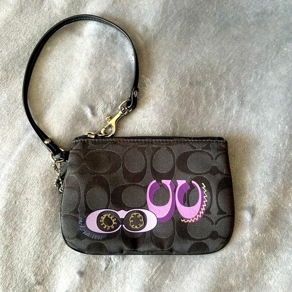 Coach Handbags - Coach zip wristlet black with purple, NWOT
